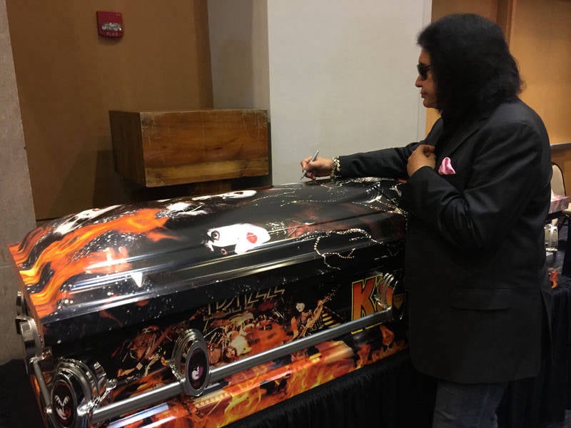 Gene Simmons signing Kiss Kasket