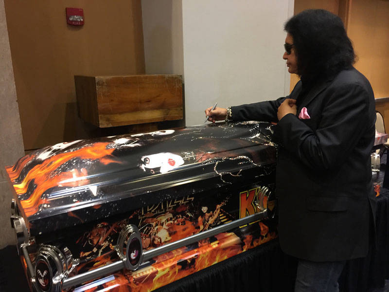 Gene Simmons signing Kiss Kasket